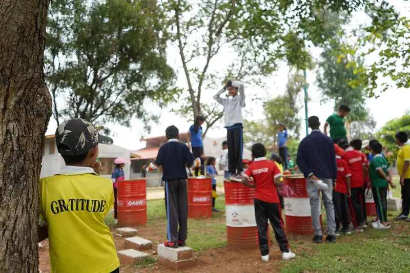 Mysuru ADDA field moment 5 — students mid-activity during an outdoor program