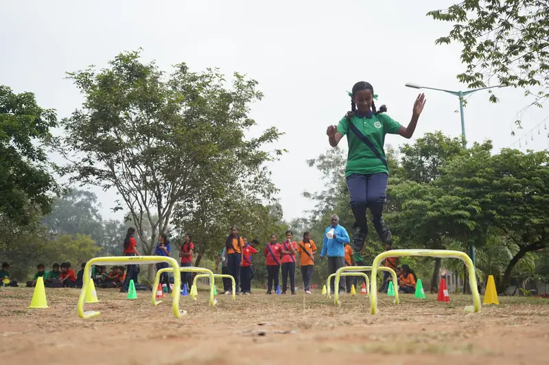Mysuru ADDA field moment 14 — students mid-activity during an outdoor program