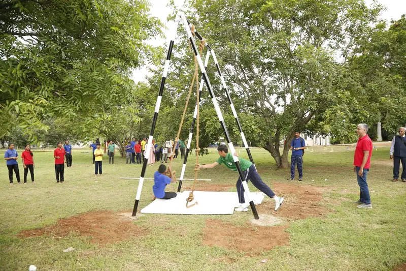 Mysuru ADDA field moment 16 — students mid-activity during an outdoor program